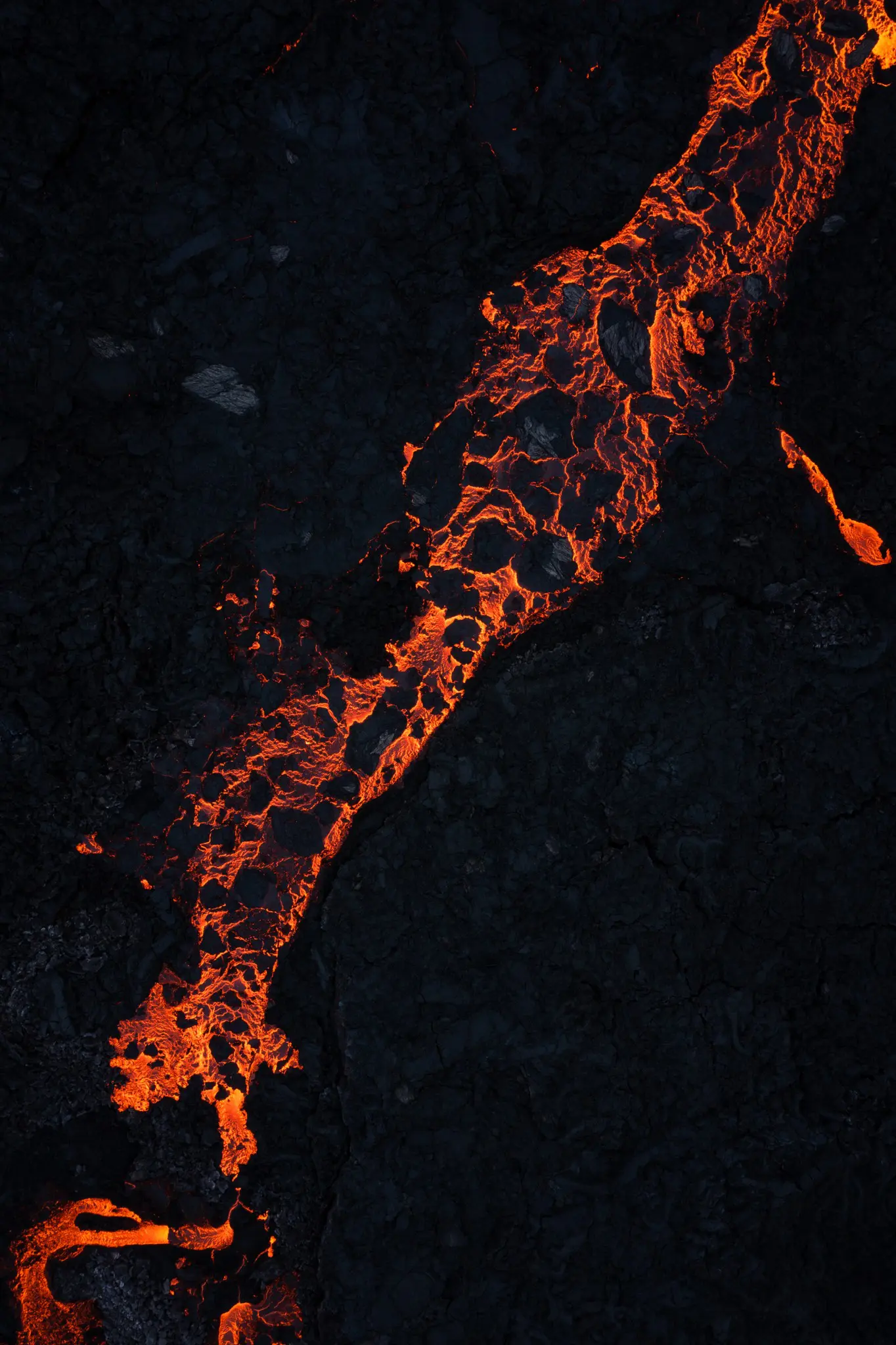 aerial view of glowing orange lava flow in Iceland