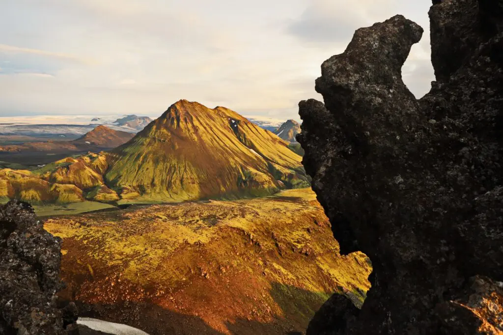 dramatic icelandic landscape with mossy mountains and volcanic rocks