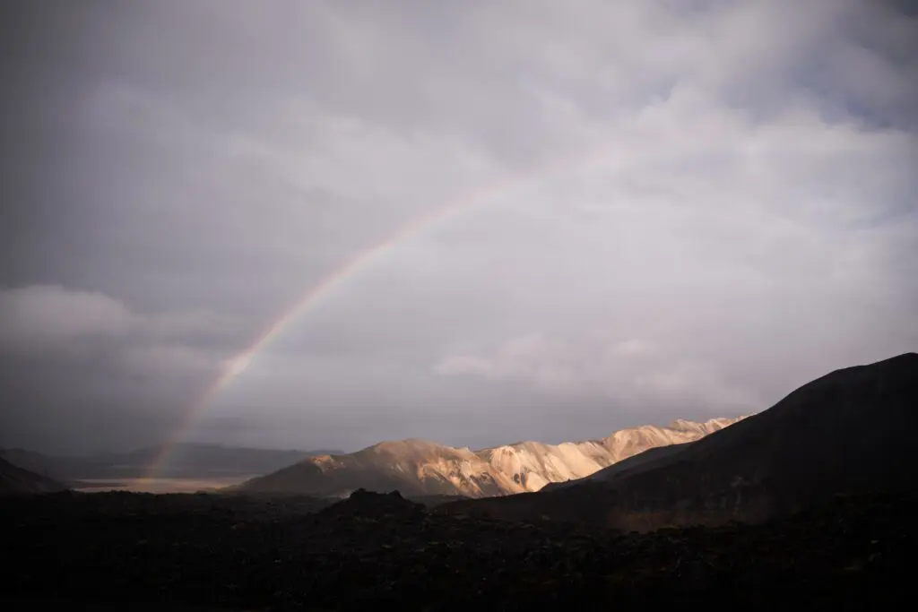 rainbow over volcanic landscape in Iceland
